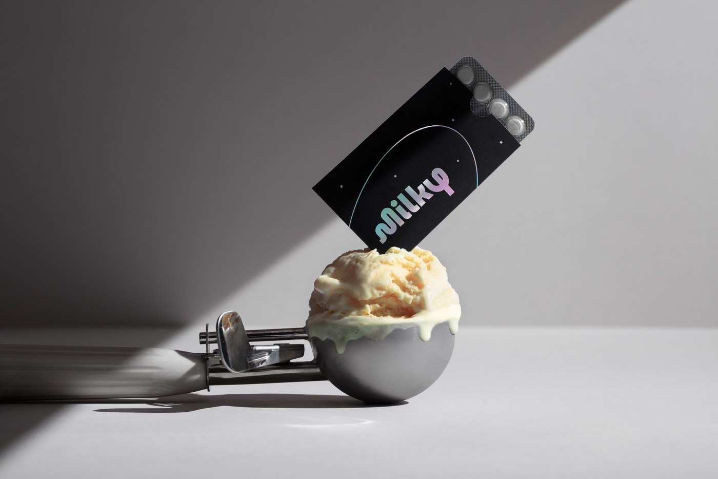 Milky lactase card and an ice cream scoop